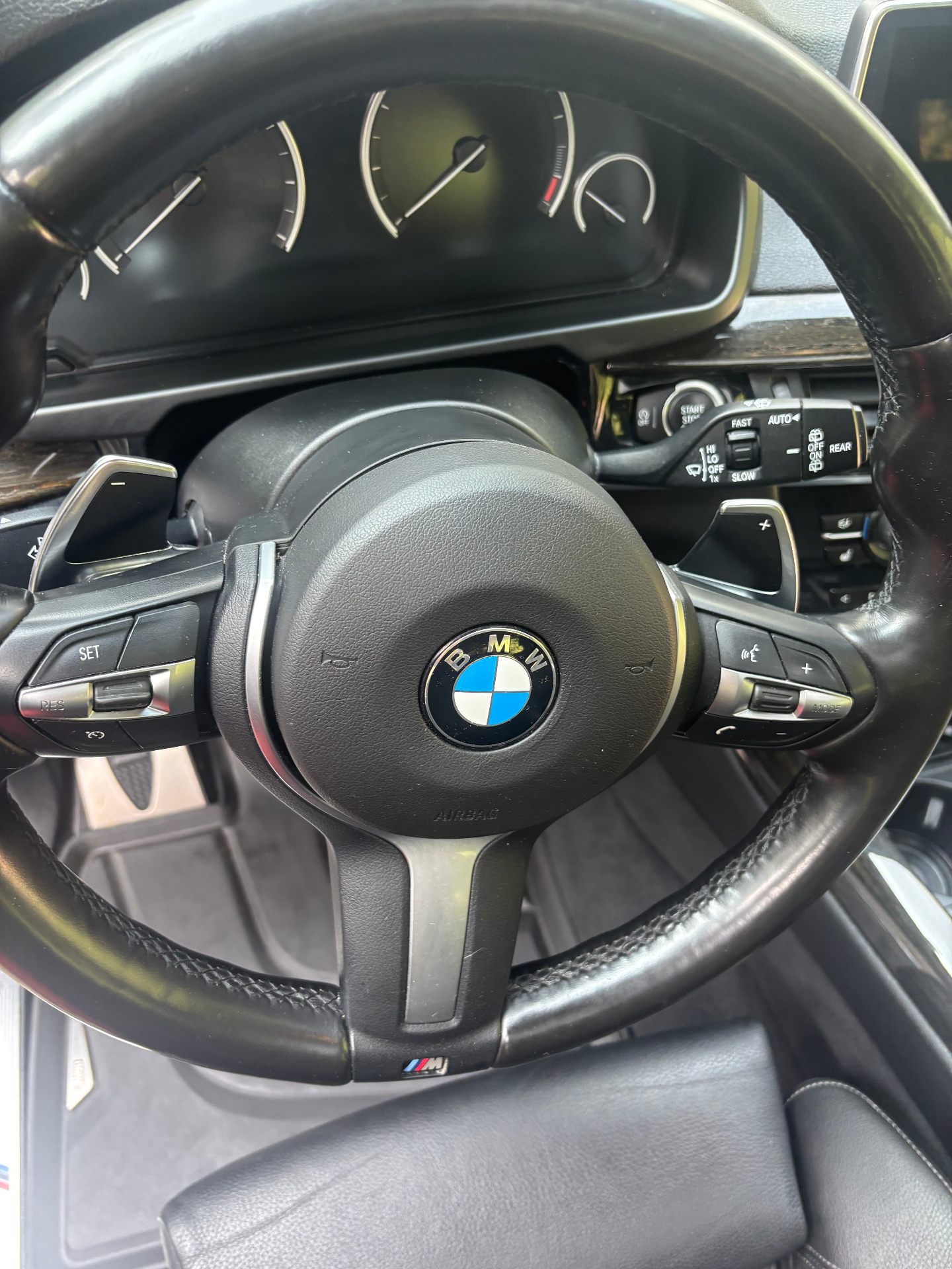 Cleaned BMW steering wheel and center console after interior detailing