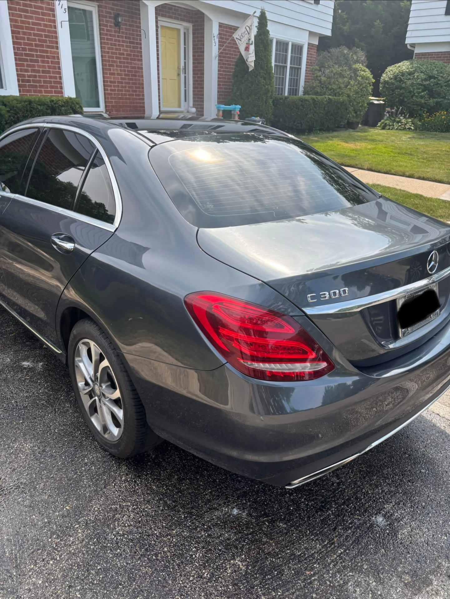 Freshly detailed hood and fender of a gray sedan on the North Shore