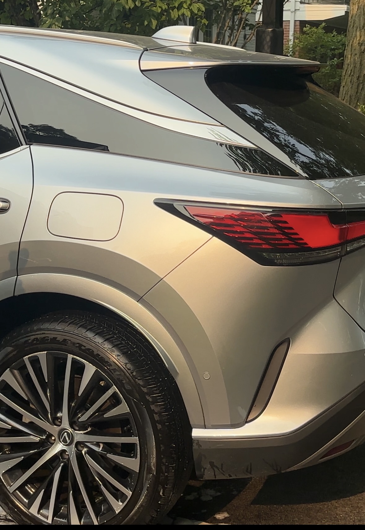 Freshly cleaned wheel and tire on a silver Lexus SUV