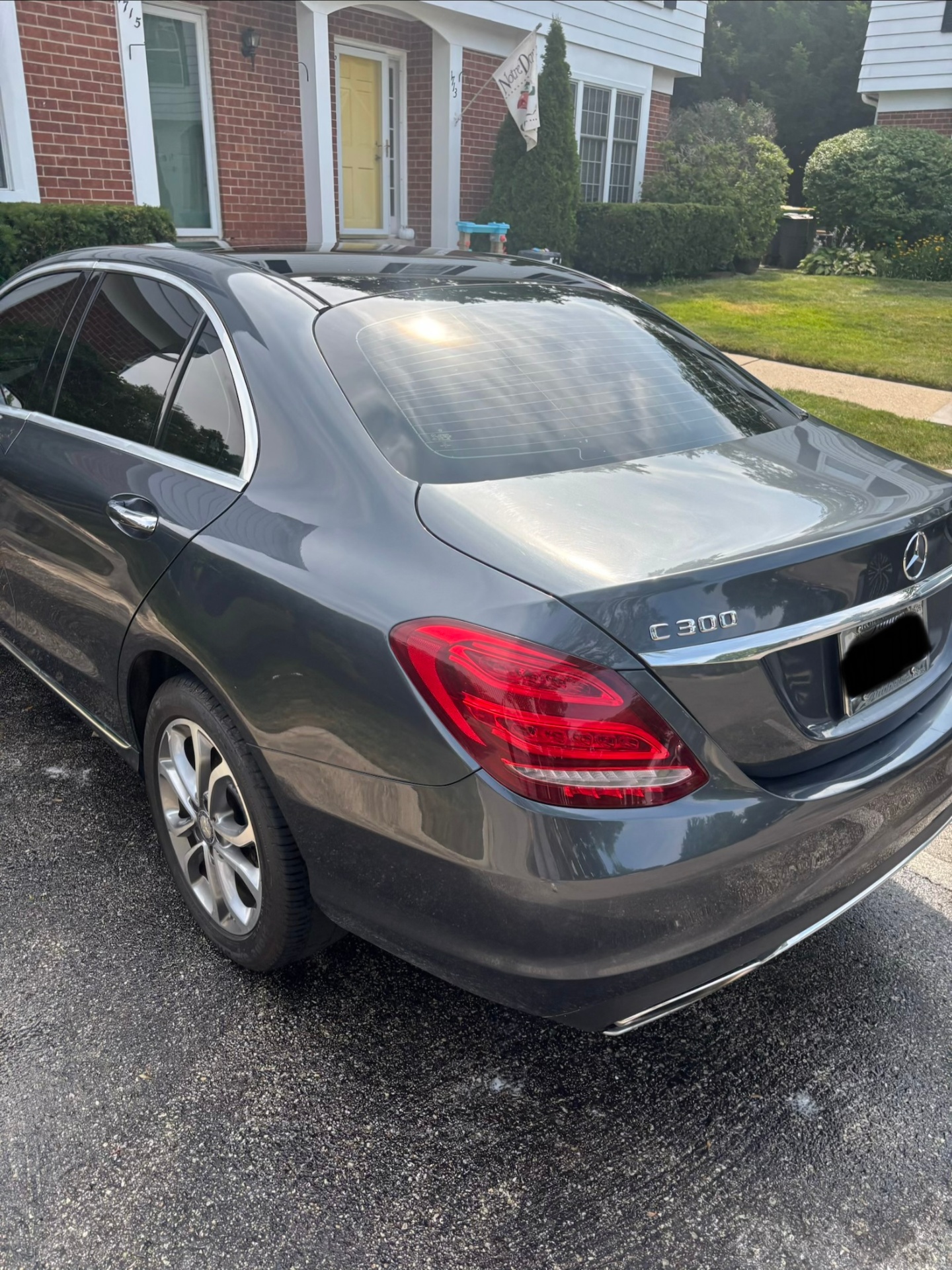 Detailed gray Mercedes-Benz sedan, rear exterior view with glossy clean finish